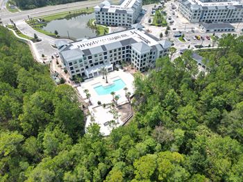 Aerial view of apartment complex with pool and courtyard